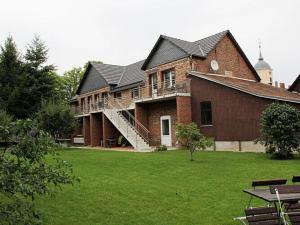 a large brick building with a large grass yard at Holiday apartment Villa Sonja 