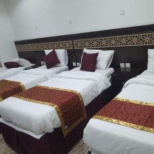 En eller flere senge i et værelse på NUZHA SQUARE