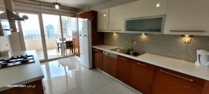 a kitchen with a sink and a counter top at Apartment Resort Bursa in Bursa