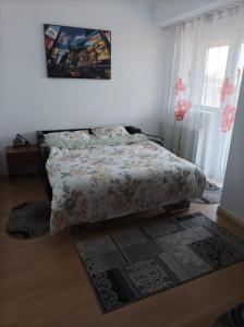 Ένα ή περισσότερα κρεβάτια σε δωμάτιο στο Apartament Alex