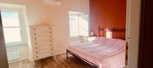 Postel nebo postele na pokoji v ubytování Tormalina rosa presso La Bordona