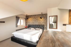 Posteľ alebo postele v izbe v ubytovaní Padre Boutique Hotel