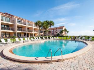 a swimming pool at a resort with lounge chairs at Sea Place 14164, 3 Bedrooms, Sleeps 8, Ground Floor, Pool, Tennis, WiFi in St. Augustine