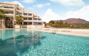 a large swimming pool in front of a building at 3 Bedroom Amazing Apartment In Estepona in Estepona