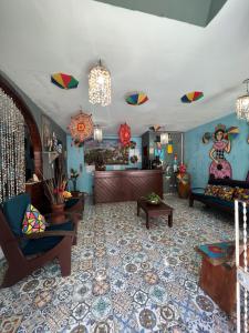 a living room with kites hanging from the ceiling at Ladeira de Olinda in Olinda