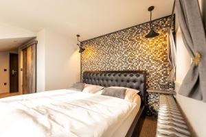 Posteľ alebo postele v izbe v ubytovaní Padre Boutique Hotel