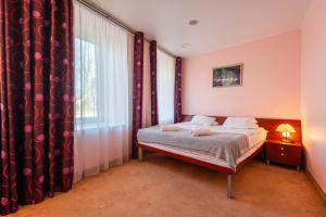 Postel nebo postele na pokoji v ubytování Hotel Medūna