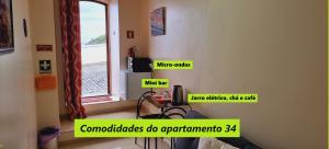a room with signs on the wall of a room at Príncipe de Mónaco Boutique House in Angra do Heroísmo +23 photos