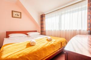 Postel nebo postele na pokoji v ubytování Hotel Medūna