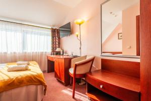 Postel nebo postele na pokoji v ubytování Hotel Medūna