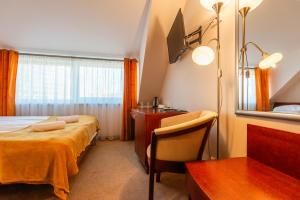 Postel nebo postele na pokoji v ubytování Hotel Medūna