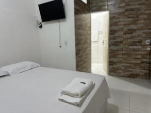מיטה או מיטות בחדר ב-Studio Executivo no Centro de Santarém -1 vaga Estacionamento, WIFI e Central de Ar