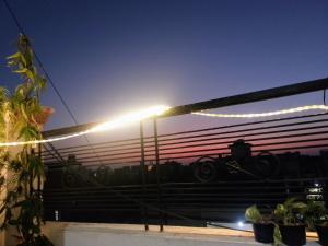 a reflection of a train in a window at night at Shri Homes in Varanasi