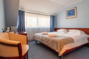 Postel nebo postele na pokoji v ubytování Hotel Medūna