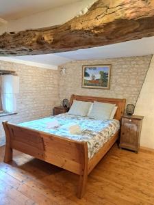 Ένα ή περισσότερα κρεβάτια σε δωμάτιο στο Le Moulin Etourneau - 3 gîtes avec 2 piscines +46 φωτογραφίες