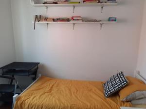 a bedroom with a bed and a desk and shelves at Greatly located/parking/balcony/2 bathrooms in Zagreb
