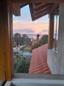 a view from a window of a roof at CASA DE LA LUNA-Isla del sol Bolivia in Comunidad Yumani