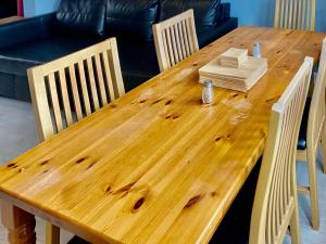 a wooden table with four chairs at Castle View in Stafford