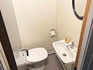 a small bathroom with a toilet and a sink at 3 person holiday home in Flatraket-By Traum in Barmen +14 photos