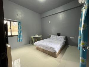 Ένα ή περισσότερα κρεβάτια σε δωμάτιο στο Sea Snail 2 B&B