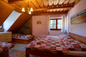 a bedroom with a large bed in a room at Zázrivský dvor in Zázrivá