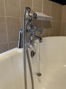 a shower in a bathroom with a bath tub at The Kings Arms Inn in Yeovil