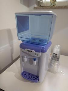 a blue and white coffee maker sitting on a counter at A Parada do Camiño in Padrón