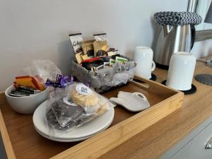 a wooden counter top with a tray with items on it at Birkdale Guest House in Shanklin