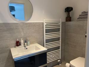 a bathroom with a sink and a mirror at Insch House in Kincraig +25 photos