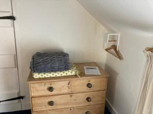 a bed on top of a dresser in a room at Bryntirion Farmhouse Room with own bathroom in Llanfair Caereinion