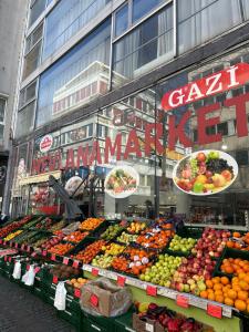a market with a display of fruits and vegetables at Emmas Lofts in Essen