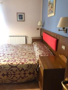 Postel nebo postele na pokoji v ubytování Albergo Miramonti
