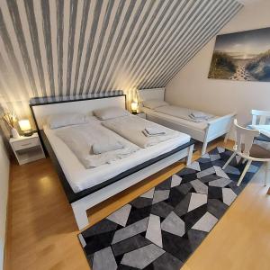 a bedroom with a bed with a striped ceiling at Landgasthof "Hotel zum Norden" in Jagel