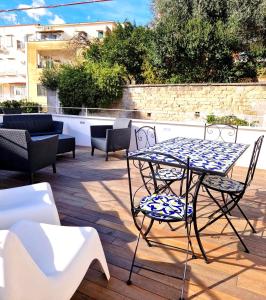 a table and chairs sitting on a patio at Domus Neapolis Happy Holiday in Naples