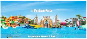 obraz parku wodnego ze zjeżdżalnią wodną w obiekcie Luxury Apartment 2BD 120m2 Al Majaz PS5, Pool, View Khalid Lac w mieście Ras al-Chajma