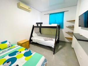 Ένα ή περισσότερα κρεβάτια σε δωμάτιο στο Apartamento Doña Flor +5 φωτογραφίες