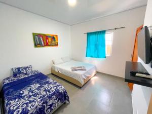 Ένα ή περισσότερα κρεβάτια σε δωμάτιο στο Apartamento Doña Flor
