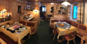 an overhead view of a restaurant with two tables and chairs at Nonas B&B in Galtür