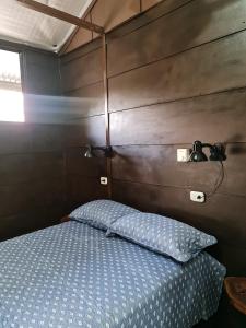 Postel nebo postele na pokoji v ubytování Cabañas MOHES ballena