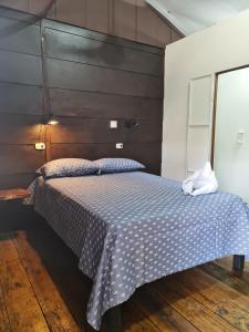 Postel nebo postele na pokoji v ubytování Cabañas MOHES ballena