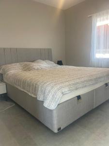 a bed sitting in a bedroom with a mattress at Ecological Lake House in Seferihisar
