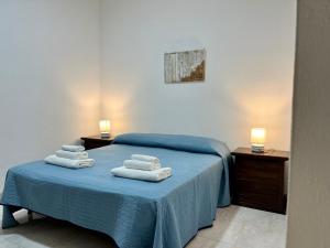 A bed or beds in a room at Residence Araba Fenice Tropea Még 37 kép