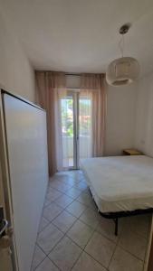 Postel nebo postele na pokoji v ubytování Residence Gabbiano Vista Mare + 3 fotografie