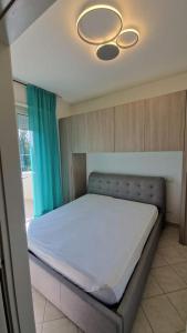 Postel nebo postele na pokoji v ubytování Residence Gabbiano Vista Mare