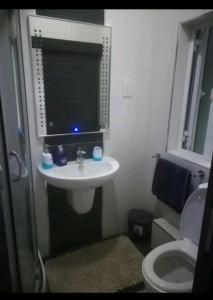 a bathroom with a sink and a toilet at Luxury Apartment close to seafront in Sliema