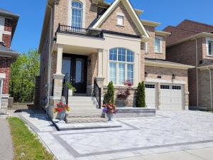 a house with a stone driveway in front of it at Jackzhang in Aurora