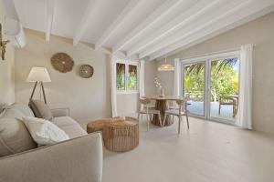 a living room with a couch and a table at Sorobon Luxury Beach Resort in Kralendijk