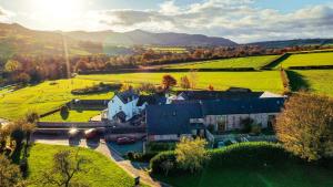 an aerial view of a house in a field at Ty Newydd B&B in Brecon