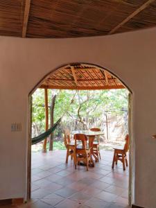 a dining room with a table and chairs at Casa Magica in Minca