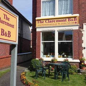 a restaurant with a table and chairs in front of a building at The Claremont in Lytham St Annes